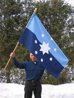 Bill Gately displays SARA flag made by his wife, Rosemary